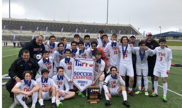 Photo of The TMI boys varsity soccer team celebrating their state championship on Feb. 22 in Waco.