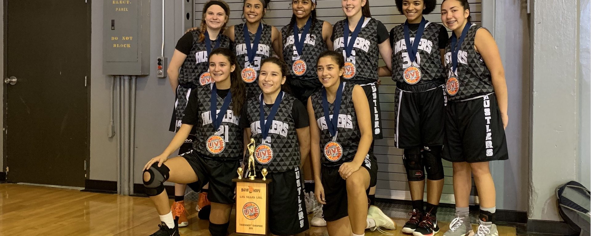 Photo of rising junior and her basketball team winning their division championship