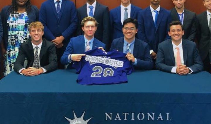 Photo of TMI Episcopal senior Zachary Addkison (standing, second from from left) celebrates July 28 with his winning team at the National Student Leadership Conference at Fordham University in New York.