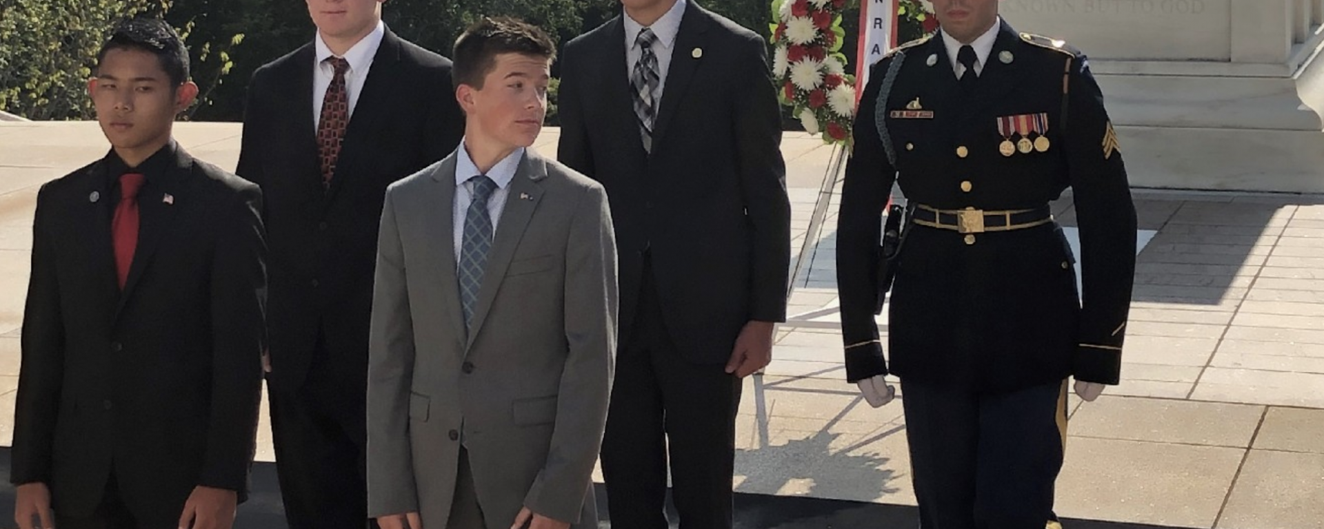 Photo of Jack Basil (back row, center), a rising junior at TMI Episcopal, takes part in a July 27 wreath-laying ceremony at the Tomb of the Unknown Soldier at Arlington National Cemetery in Virginia.